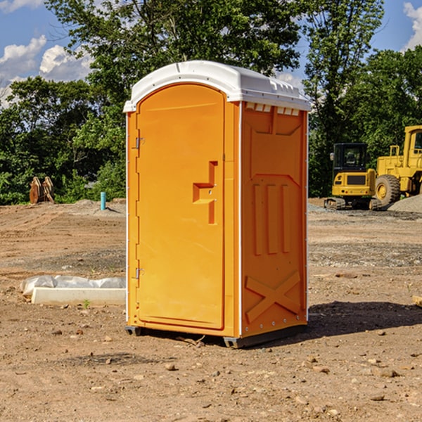 what is the cost difference between standard and deluxe portable restroom rentals in Bondurant